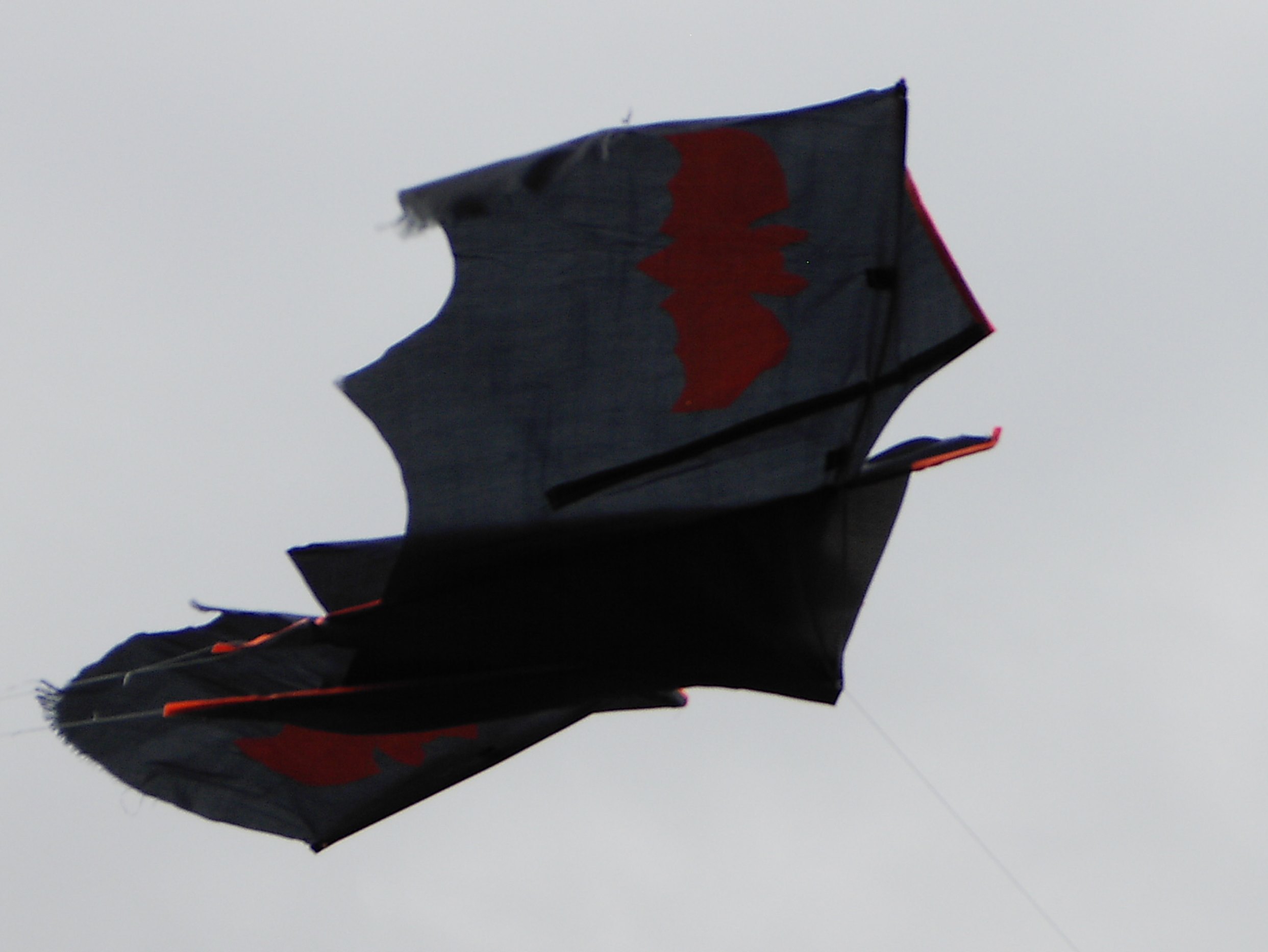 Batkite flying fraying apart.